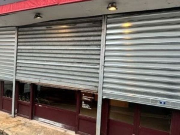 Intervention d'urgence pour rideau métallique au centre commercial Passage des Ménétriers à Paris 3