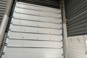 Réparation porte sectionnelle Reims en urgence